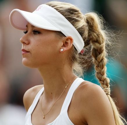 Anna-Kournikova-in-a-ponytail-and-white-visor-during-Wimbledon-2010_1238391_0.jpg